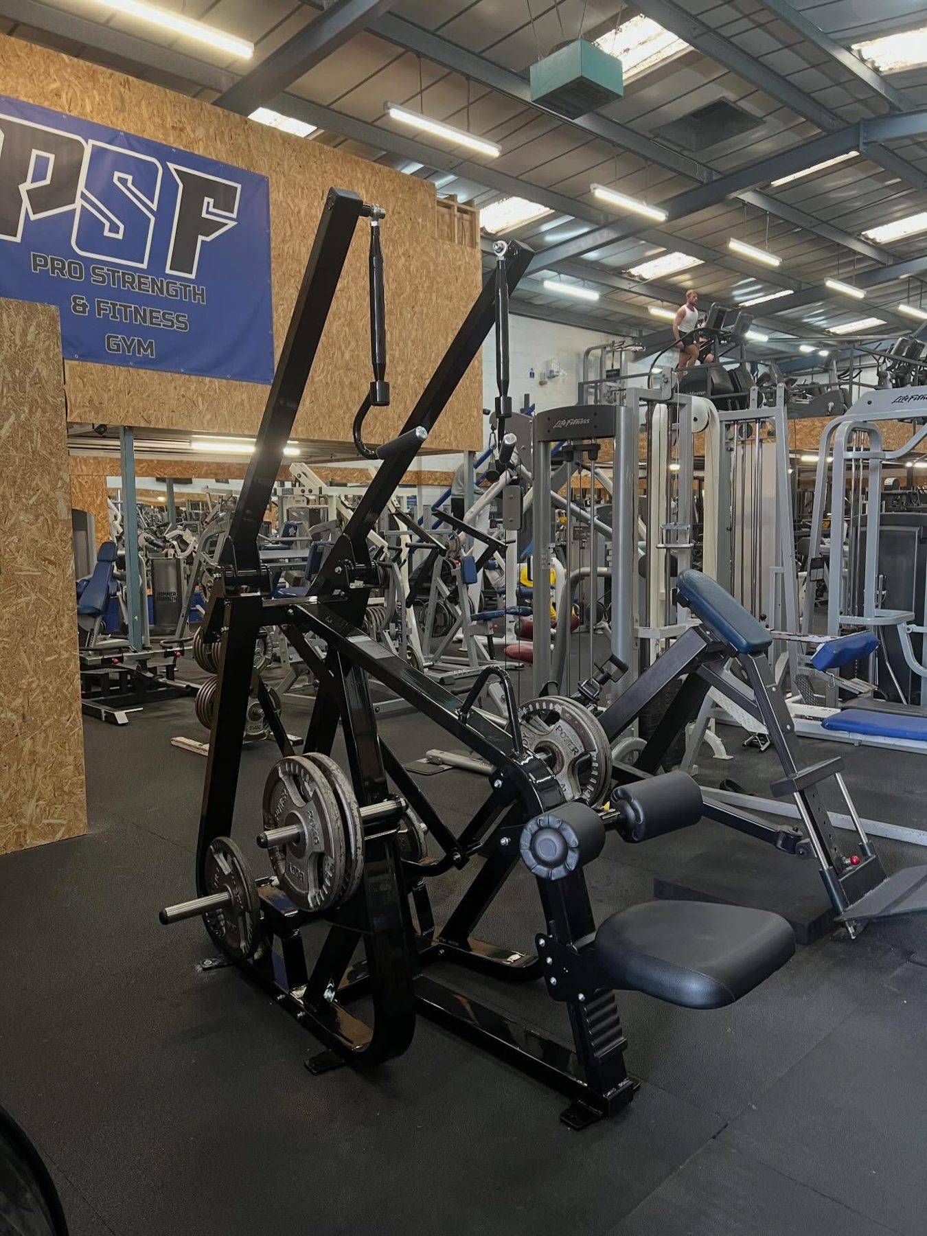 Selectorised resistance machines lined up on the main floor